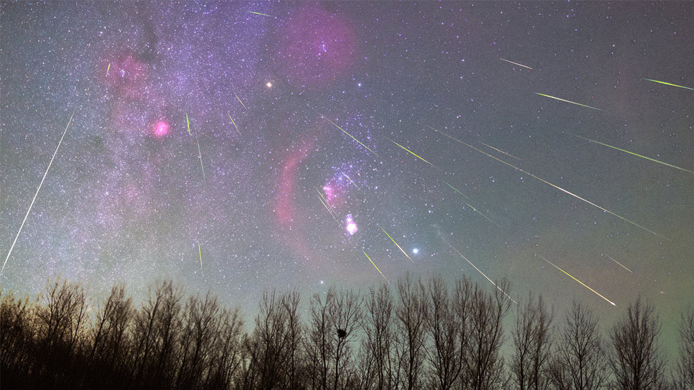 Orionid meteor shower with multiple meteors streaking across a dark star-filled sky